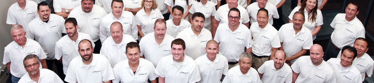 Mark VII car wash team all wearing matching white polos.