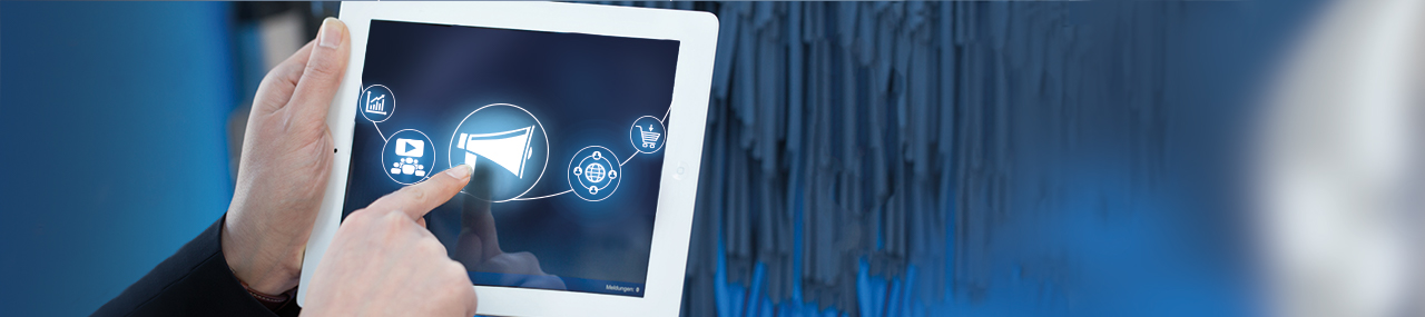 A hand holding a white tablet with multiple icons shown pressing the alarm icon.