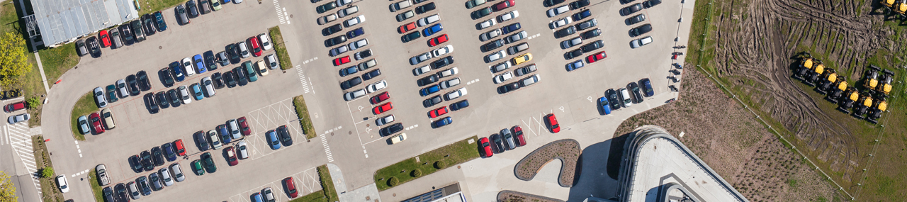 Overhead drone shot of the WashTec parling lot filled with cars.