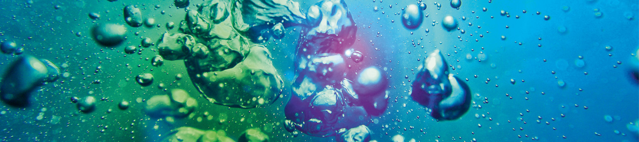 Air bubble in a pool of water with different colors flowing through it. 