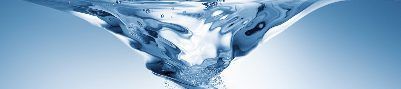 Water spinning in a vortex being pulled into a Mark VII car wash.